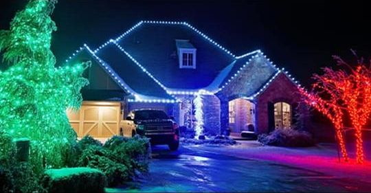 Holiday Christmas lighting installation on a home
